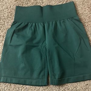 NVGTN size small green solid seamless shorts.